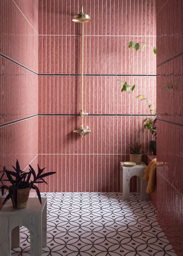 Pink Tiled Bathroom with Patterned Tile Floor