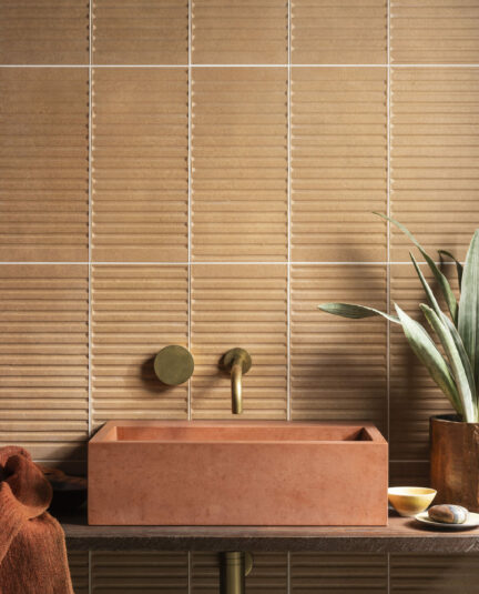 Stylish bathroom interior with patterned ceramic wall tiles.