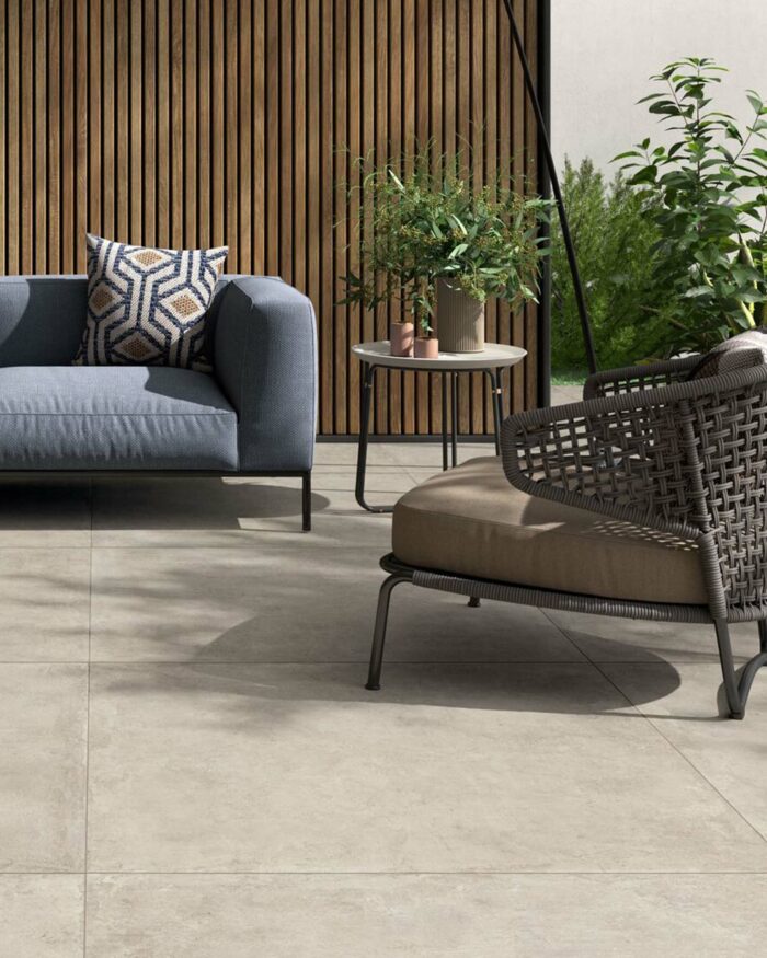 Stylish outdoor patio area with garden furniture and Berlin Sand Outdoor Matt Porcelain stone effect floor tiles