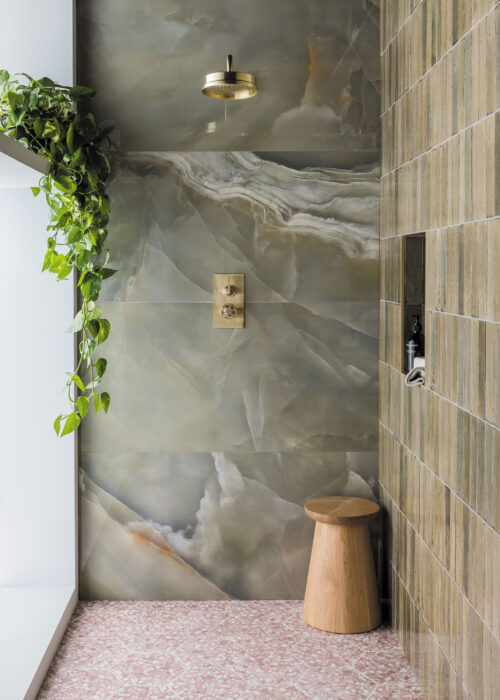 Stylish bathroom with green wall tiles.